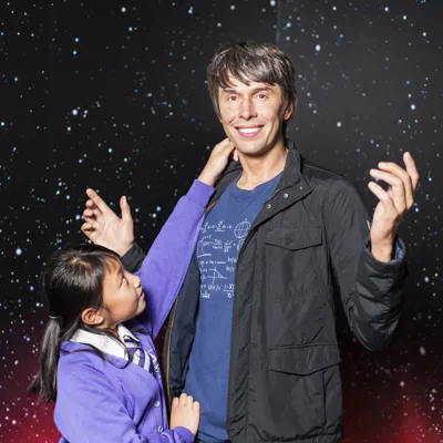 School pupil standing next to Brian Cox figure