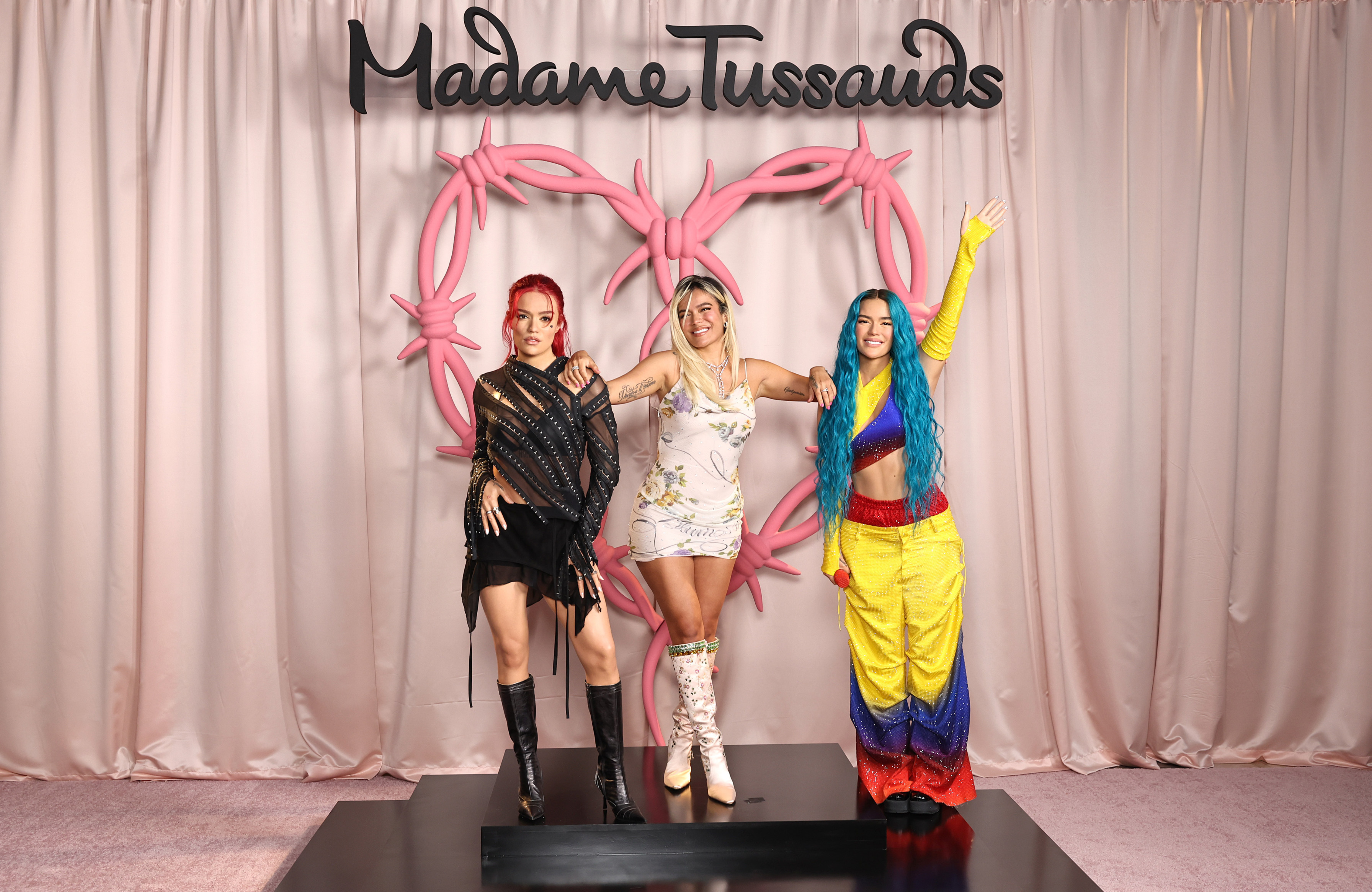 Karol G poses with her first ever wax figures | Madame Tussauds Las Vegas