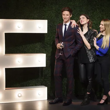 Fans leaning on Eddie Redmayne figure at Madame Tussauds London