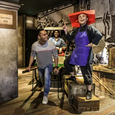 Man pulling rickshaw in Images of Singapore inside Madame Tussauds Singapore