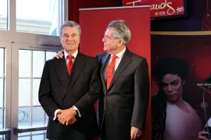 Former president Heinz Fischer next to his wax figure at Madame Tussauds™ Vienna