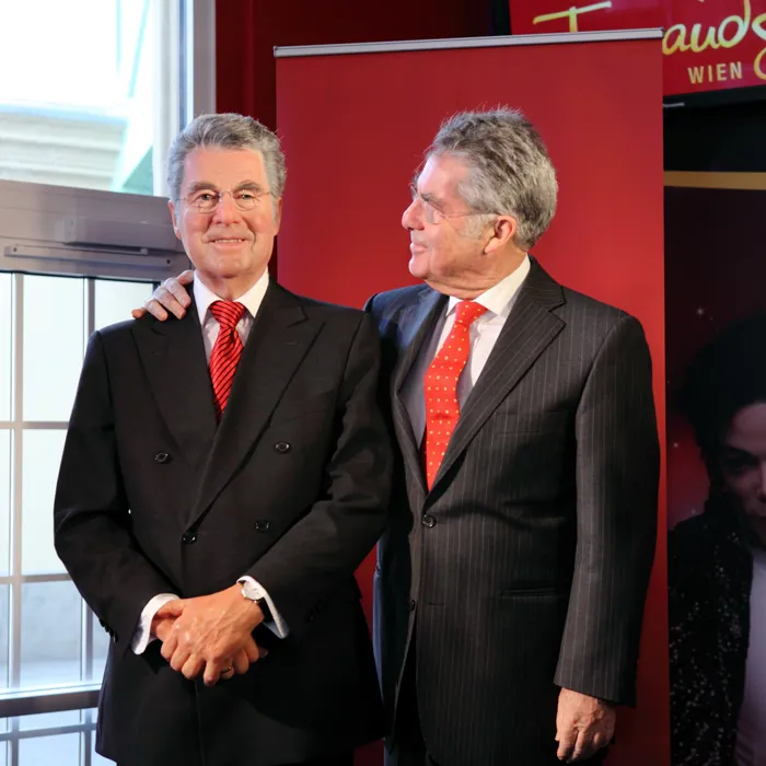 Former president Heinz Fischer next to his wax figure at Madame Tussauds™ Vienna